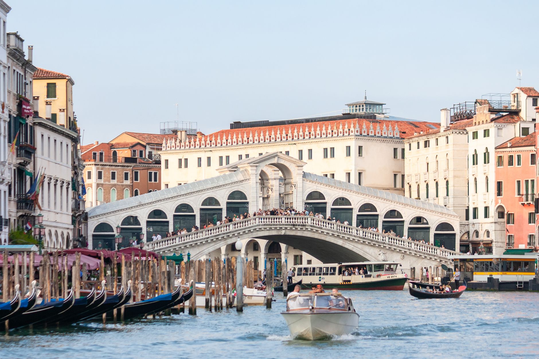 Rialto Bridge with boats on the Grand Canal in Venice, Italy