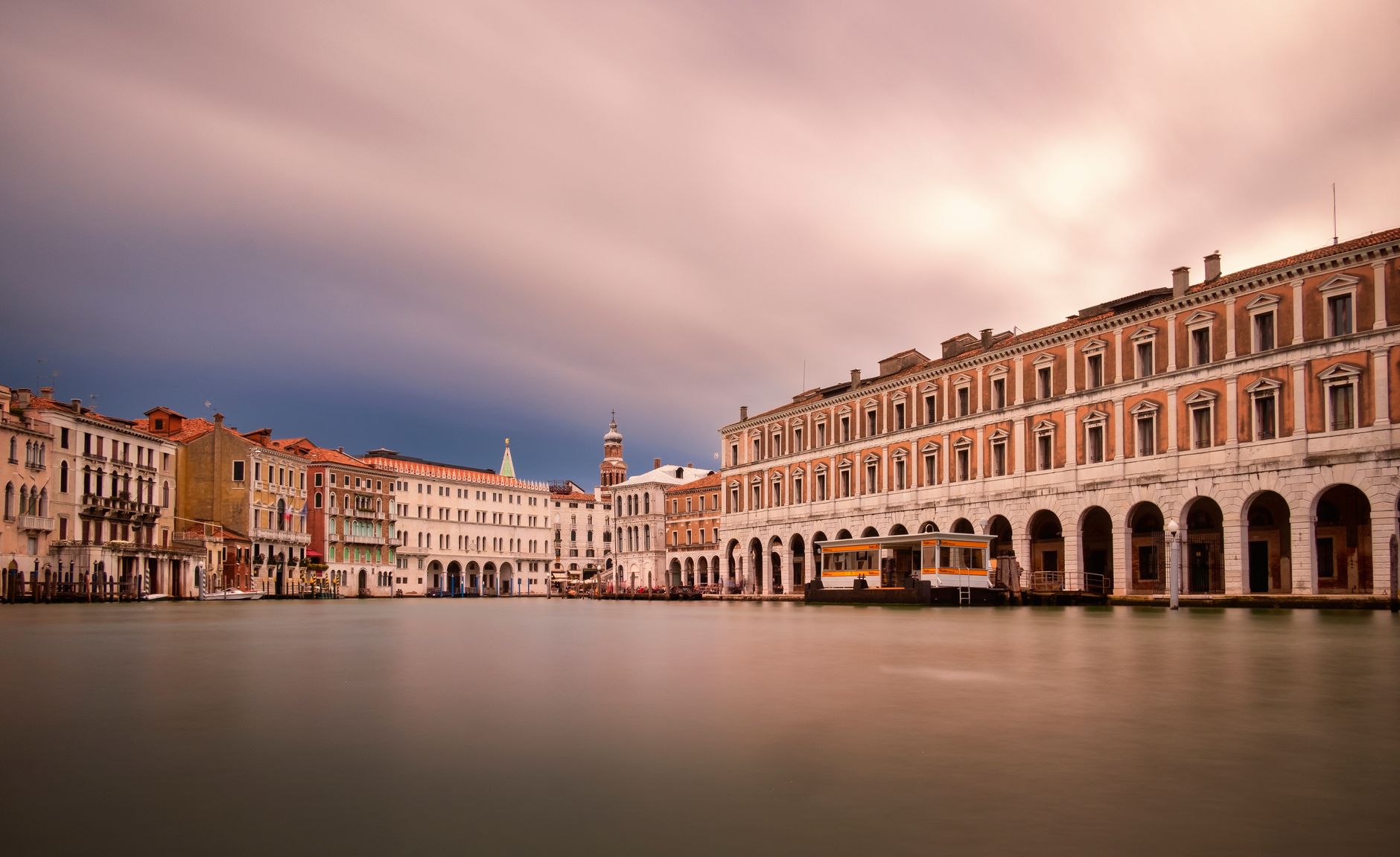 Venice's Grand Canal at dusk, showcasing traditional architecture and gondolas