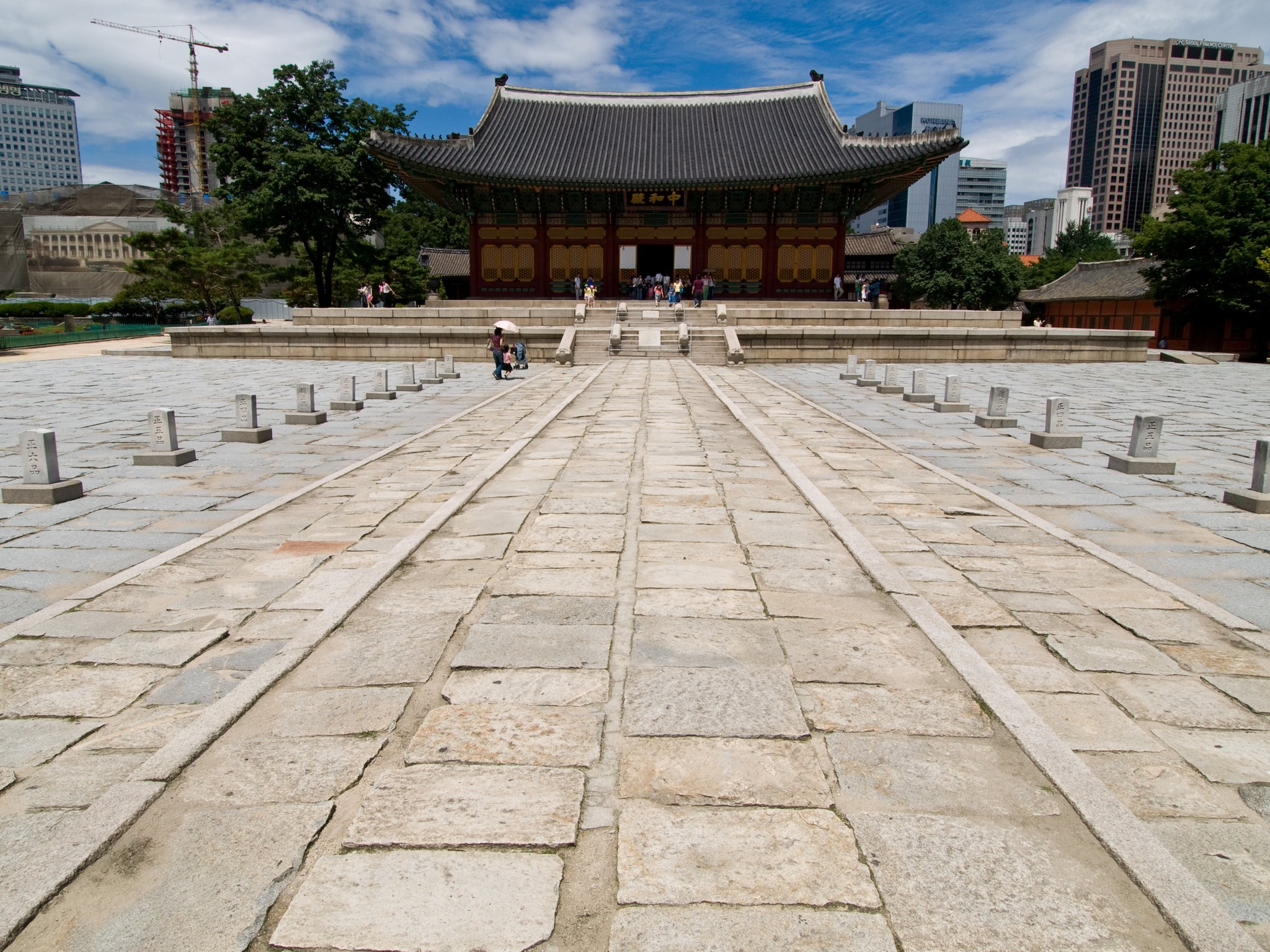 The broad stone approach to Junghwajeon lined with its ranked stone markers