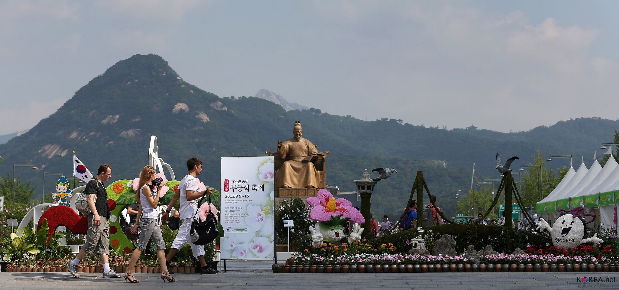 The gilded statue of King Sejong on Gwanghwamun Square during a festival