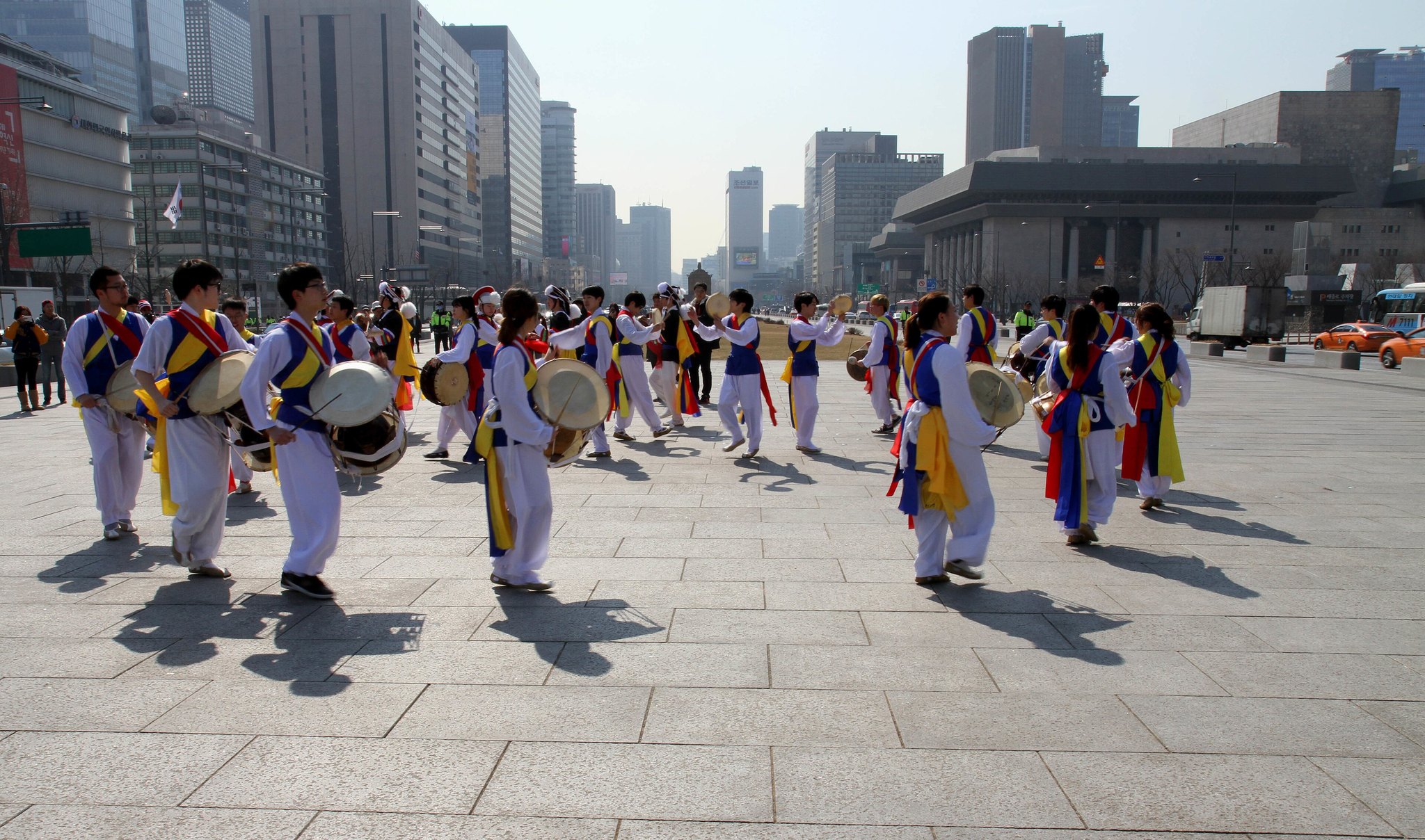 A traditional drumming and dance troupe performing in costume on Gwanghwamun Square