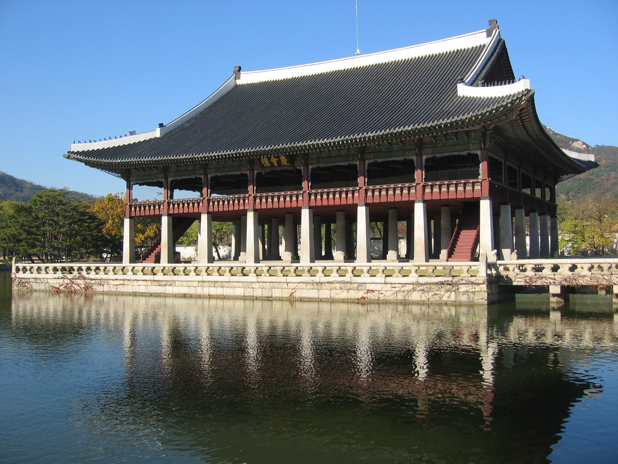 The two-storey Gyeonghoeru banqueting pavilion standing on stone pillars in its pond