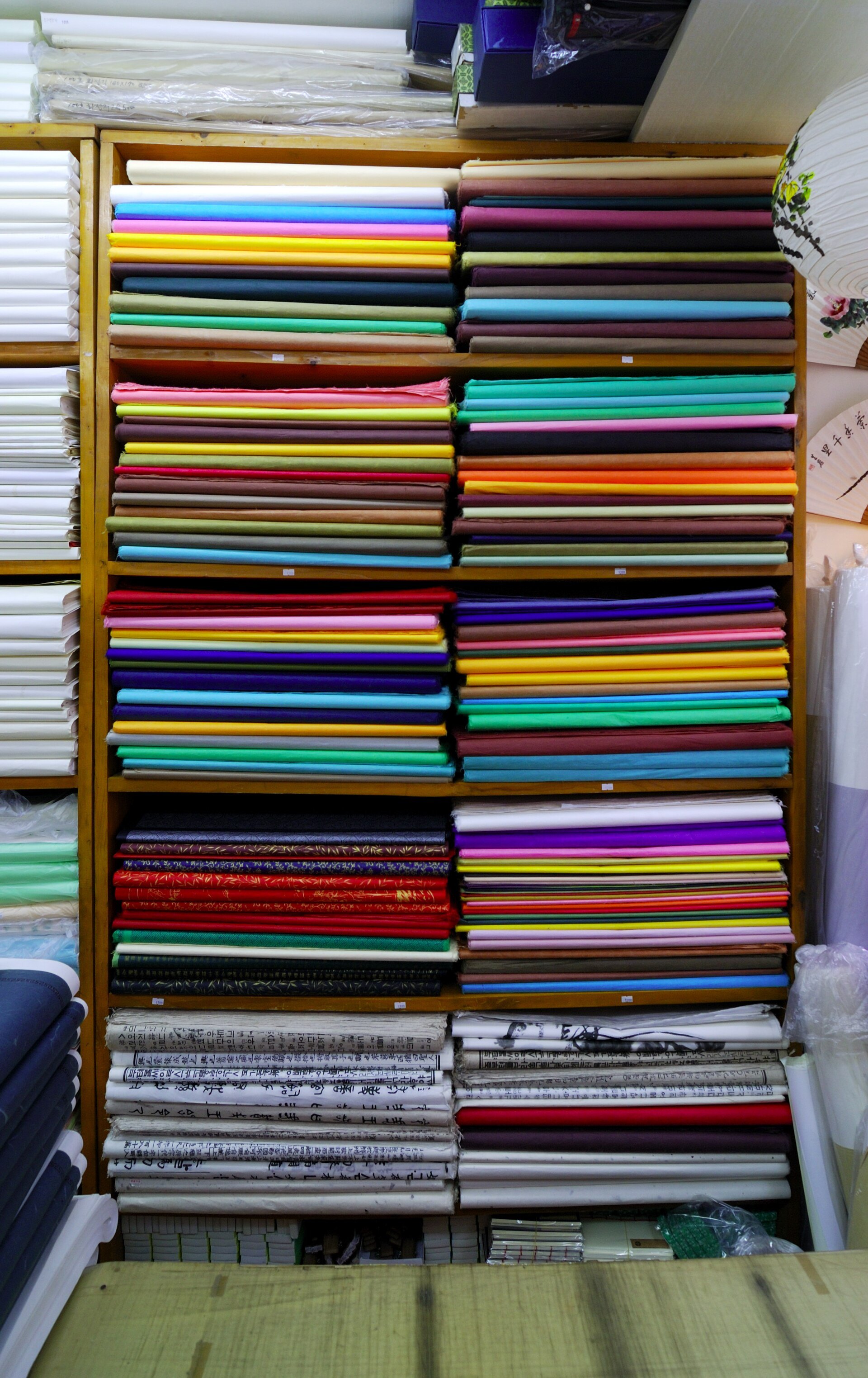 Stacks of coloured hanji paper in an Insadong paper shop