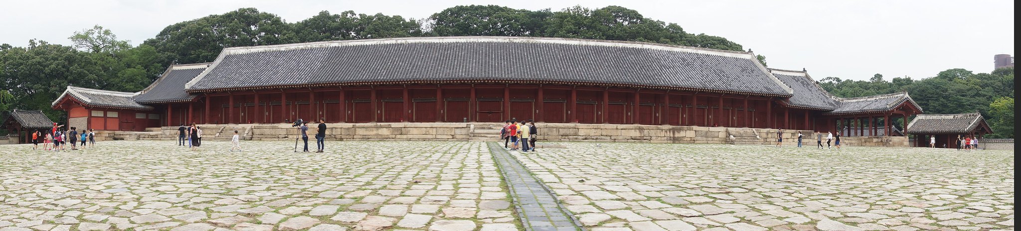 The long low hall of Jongmyo's Jeongjeon stretching the width of its stone courtyard